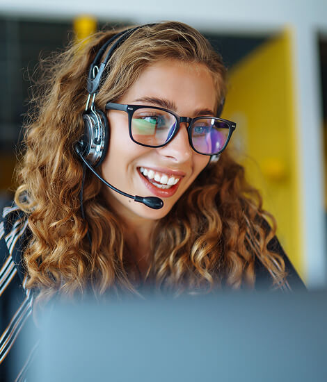 Customer service operator wearing a headset and glasses