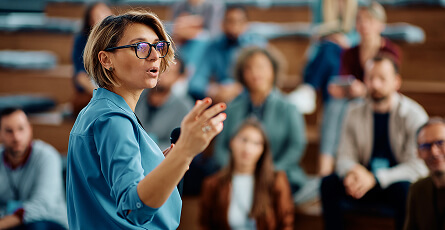 Speaker presenting to an audience at a seminar