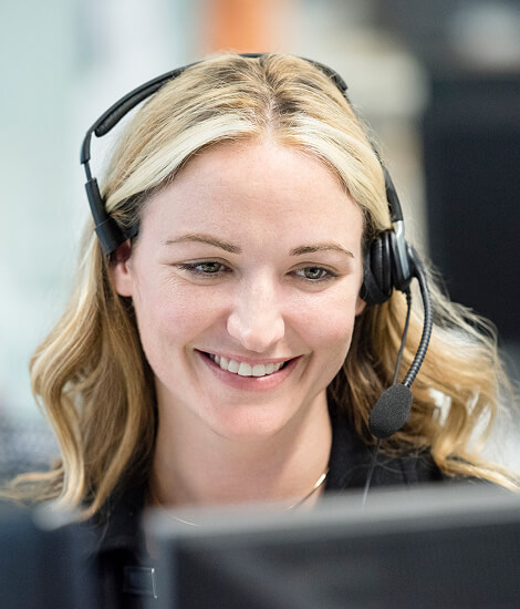 Smiling support agent wearing a headset