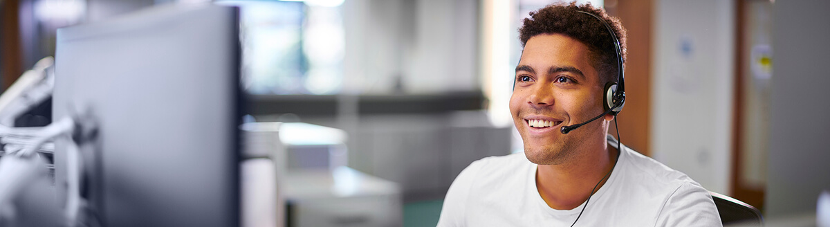 Smiling customer service representative wearing a headset