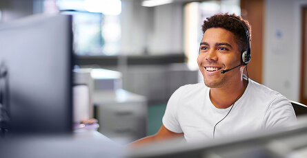 Smiling customer service representative wearing a headset
