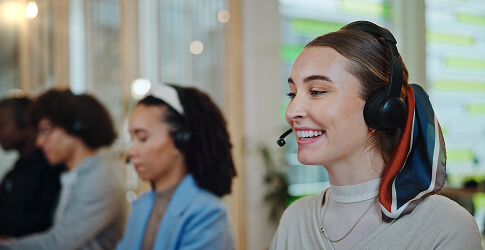 Smiling customer service agent wearing a headset