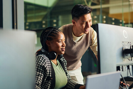 Colleagues reviewing an issue on a computer screen