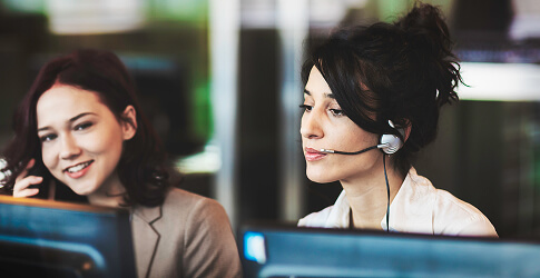 Customer support operators wearing headsets