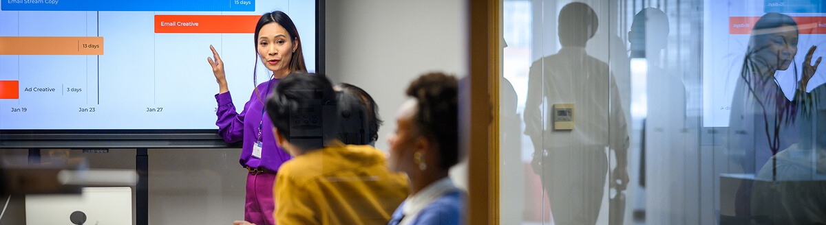 Team leader presenting to colleagues in an office