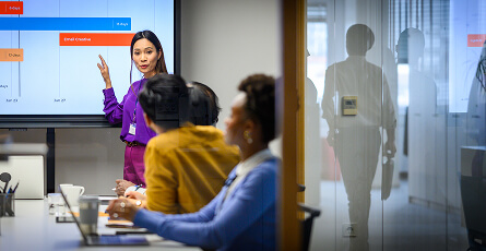Team leader presenting to colleagues in an office